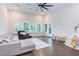 Spacious living room with hardwood floors, vaulted ceiling, and many windows bringing the outdoors in at 112 Bellmont Crest Dr, Holly Springs, NC 27540