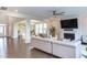 Stylish living room with fireplace, hardwood floors, and open layout with access to other rooms at 112 Bellmont Crest Dr, Holly Springs, NC 27540