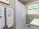 Well-lit bathroom with shower and decorative floor tiles, offering a clean and practical design at 114 Brenrose Cir, Durham, NC 27705
