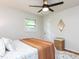 Serene bedroom featuring a ceiling fan, hardwood floors with rug, and a minimalist style at 114 Brenrose Cir, Durham, NC 27705