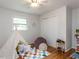 bedroom featuring playful decor, a cozy teepee tent, and hardwood floors complemented by a patterned rug at 114 Brenrose Cir, Durham, NC 27705