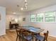 Well-lit dining room with a modern table set and a view of the outdoor scenery at 114 Brenrose Cir, Durham, NC 27705