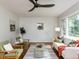 Spacious living room with hardwood floors, comfortable seating, and ample natural light at 114 Brenrose Cir, Durham, NC 27705