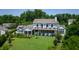 Aerial view showcases landscaping, screened porch and covered porch at 115 Founders Ridge Dr, Chapel Hill, NC 27517