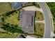 Aerial view of a well-maintained property showcasing lush landscaping, a spacious yard, and a charming home at 115 Founders Ridge Dr, Chapel Hill, NC 27517