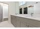 Stylish bathroom featuring double vanity, quartz countertop, and modern faucets, complemented by tile flooring and shower at 115 Founders Ridge Dr, Chapel Hill, NC 27517