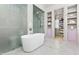 This bathroom has a soaking tub, walk-in shower, and storage shelves at 115 Founders Ridge Dr, Chapel Hill, NC 27517