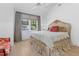 Sun-filled bedroom with large window, ornate bed and hardwood floors at 115 Founders Ridge Dr, Chapel Hill, NC 27517