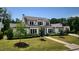 Beautiful two-story home with a well-maintained lawn and professional landscaping at 115 Founders Ridge Dr, Chapel Hill, NC 27517