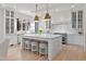 Bright kitchen features white cabinets, granite countertops, and stainless steel appliances at 115 Founders Ridge Dr, Chapel Hill, NC 27517