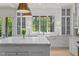 Bright kitchen featuring granite countertops, white cabinets, and stainless steel appliances at 115 Founders Ridge Dr, Chapel Hill, NC 27517