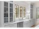 Charming kitchen with bright window over sink, glass cabinets and marble countertops at 115 Founders Ridge Dr, Chapel Hill, NC 27517