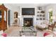 Cozy living room features a fireplace, built-in shelving, and comfortable seating at 115 Founders Ridge Dr, Chapel Hill, NC 27517