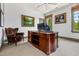 Bright office with hardwood desk, rolling chair, and elegant design at 115 Founders Ridge Dr, Chapel Hill, NC 27517