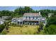 Beautifully landscaped property with a spacious backyard, screened porch, and charming back patio at 115 Founders Ridge Dr, Chapel Hill, NC 27517