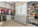 Walk-in closet with lots of shelves, hanging clothes, and a small window at 115 Founders Ridge Dr, Chapel Hill, NC 27517