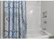 Clean bathroom with blue patterned shower curtain and subway tile shower at 115 Heatherwood Dr, Apex, NC 27502