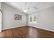 Bedroom featuring hardwood floors, natural light, and neutral paint at 115 Heatherwood Dr, Apex, NC 27502