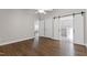 Bedroom featuring hardwood floors, open sliding doors, and natural light at 115 Heatherwood Dr, Apex, NC 27502