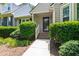Charming home entrance with well-manicured bushes and greenery at 115 Heatherwood Dr, Apex, NC 27502