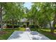 Beautiful house features a well-maintained front yard with mature trees and charming curb appeal at 115 Heatherwood Dr, Apex, NC 27502