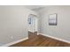 Hallway decorated with modern artwork and wood look flooring at 115 Heatherwood Dr, Apex, NC 27502