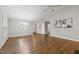 Bright and open living area with neutral walls, hardwood floors, and modern lighting at 115 Heatherwood Dr, Apex, NC 27502