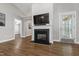 Cozy living room with a fireplace, television, and view to the outside at 115 Heatherwood Dr, Apex, NC 27502