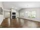 Spacious living room featuring vaulted ceilings, a fireplace, and hardwood floors at 115 Heatherwood Dr, Apex, NC 27502