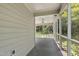 Enjoy this screened porch with ceiling fan overlooking a backyard at 115 Heatherwood Dr, Apex, NC 27502