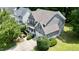 An aerial shot of the property showcasing the home's exterior, landscaping, driveway, and surrounding neighborhood at 1230 Golden Bluff Ln, Fuquay Varina, NC 27526