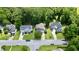 Aerial view showing the property nestled within a neighborhood with tree-lined streets and well-maintained homes at 1230 Golden Bluff Ln, Fuquay Varina, NC 27526