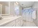 A clean bathroom featuring double sinks, modern fixtures, and a shower/tub combo at 1230 Golden Bluff Ln, Fuquay Varina, NC 27526