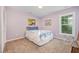 A comfortable bedroom features a window and warm-toned walls at 1230 Golden Bluff Ln, Fuquay Varina, NC 27526