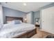 This bedroom features a large bed, ample natural light, and neutral paint at 1230 Golden Bluff Ln, Fuquay Varina, NC 27526