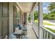 Inviting front porch featuring rocking chairs, a charming birdhouse, and an exterior view of the street and landscape at 1230 Golden Bluff Ln, Fuquay Varina, NC 27526