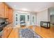 Cozy breakfast nook with fireplace, bay window, and hardwood flooring at 1230 Golden Bluff Ln, Fuquay Varina, NC 27526
