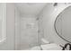Updated bathroom featuring a new tiled shower with glass doors and modern fixtures at 1308 Swallow Dr, Raleigh, NC 27606