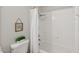 Bright bathroom featuring a shower-tub combination with a white tile surround and decorative accents at 1308 Swallow Dr, Raleigh, NC 27606