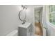 Bathroom with updated vanity, modern fixtures, and a doorway leading to another room at 1308 Swallow Dr, Raleigh, NC 27606
