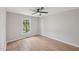 Light-filled bedroom with wood-look flooring, light walls, and a ceiling fan for added comfort at 1308 Swallow Dr, Raleigh, NC 27606