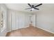 Bedroom featuring wood flooring, a ceiling fan, and a closet with bi-fold doors at 1308 Swallow Dr, Raleigh, NC 27606