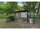 Chicken coop and run sitting in the yard at 1308 Swallow Dr, Raleigh, NC 27606