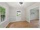 Inviting dining space featuring hardwood floors and neutral paint with a view to the backyard at 1308 Swallow Dr, Raleigh, NC 27606