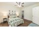 Comfortable bedroom with ceiling fan, hardwood floors, and natural light, creating a relaxing atmosphere at 1318 N Alston Ave, Durham, NC 27701