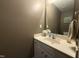 Clean bathroom features large mirror, tile floors, and a granite countertop at 148 Langston Ridge Dr Dr, Angier, NC 27501