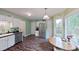 Eat-in kitchen boasts stainless steel appliances, wood floors, and a bright window overlooking the backyard at 148 Langston Ridge Dr Dr, Angier, NC 27501
