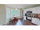 Eat-in kitchen features stainless steel appliances, wood floors, and plenty of natural light at 148 Langston Ridge Dr Dr, Angier, NC 27501