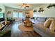 Inviting living room featuring wood floors, ceiling fan, and comfortable seating arrangement at 148 Langston Ridge Dr Dr, Angier, NC 27501