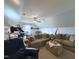 Living room with vaulted ceilings, fan, sofa, and comfortable seating at 148 Langston Ridge Dr Dr, Angier, NC 27501